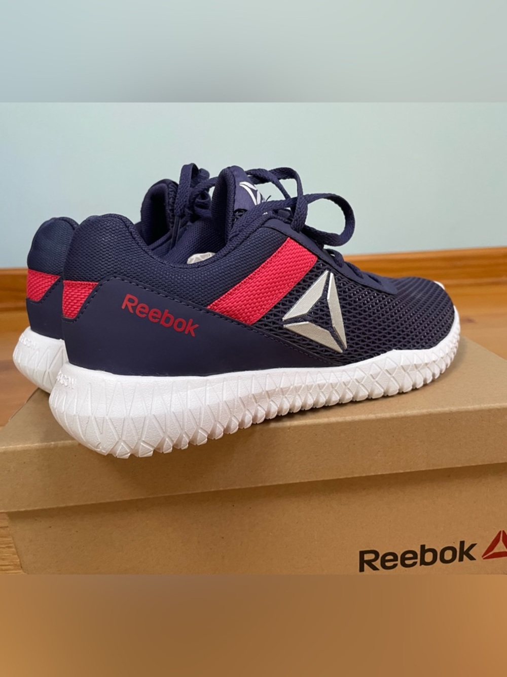 Reebok lady’s Navy and Red Running Sneakers